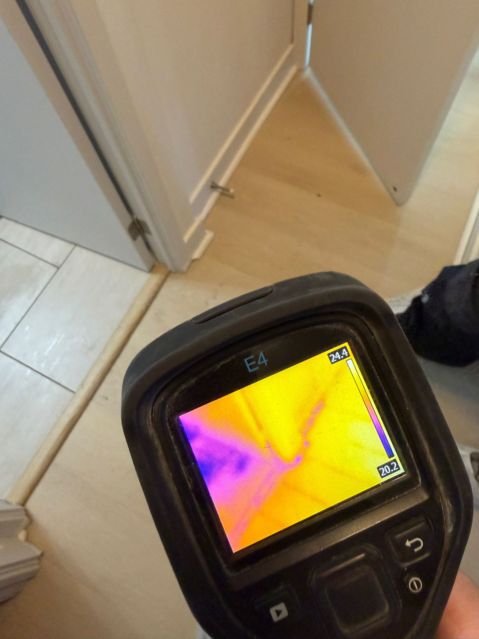 Moisture meter reading during water damage inspection